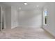 Spacious bedroom with neutral carpet and large window at 6830 Heard Ln, Cumming, GA 30041