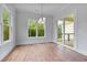 Dining room with hardwood floors, bright windows, and outdoor access at 6830 Heard Ln, Cumming, GA 30041
