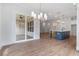 Open kitchen and dining area with an island and stainless steel appliances at 6830 Heard Ln, Cumming, GA 30041