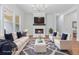 Bright, open living area featuring a fireplace and comfortable seating at 6830 Heard Ln, Cumming, GA 30041