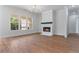 Spacious living area showcasing a fireplace and natural light at 6830 Heard Ln, Cumming, GA 30041