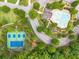 Aerial view showcasing community pool, tennis courts, winding roads, and lush greenery from above at , Cumming, GA 30041