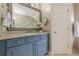Bathroom vanity with granite counters and large mirror at , Cumming, GA 30041