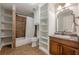 Charming bathroom with tiled shower, built-in storage, and vanity with granite countertops at , Cumming, GA 30041