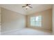 Serene bedroom with neutral walls, a large window with blinds, and soft carpet flooring at , Cumming, GA 30041