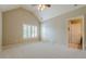 Bright bedroom with vaulted ceiling, neutral carpeting, plantation shutters, and ensuite bathroom at , Cumming, GA 30041