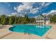 A spacious community pool with shallow area, surrounded by lounge chairs and lush landscaping at , Cumming, GA 30041