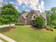 Charming two-story brick home boasts professional landscaping, a manicured lawn and a private drive at , Cumming, GA 30041