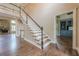 Bright foyer with hardwood floors, grand staircase, and views of the living room and study at , Cumming, GA 30041