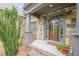 Charming stone entryway with a stylish wood door and meticulously maintained landscaping for a welcoming curb appeal at , Cumming, GA 30041