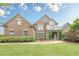 Beautiful two-story brick home with a manicured front lawn and stone accents at , Cumming, GA 30041