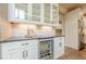 Entertainer's kitchen features a beverage fridge, custom cabinetry, and attractive countertops at , Cumming, GA 30041