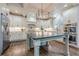 Modern kitchen with stainless steel appliances, large island, custom cabinets, and ample counter space at , Cumming, GA 30041
