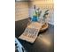 Kitchen counter decorated with a wine bottle, glasses, a decorative tray, and a burlap towel at , Cumming, GA 30041