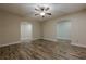 Spacious living area featuring hardwood floors, neutral walls, and multiple entryways at , Cumming, GA 30041