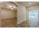 Open-concept living room featuring hardwood floors, neutral walls, and an arched doorway at , Cumming, GA 30041