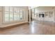 Bright and airy living room featuring hardwood floors, large windows with shutters, and open to the kitchen at , Cumming, GA 30041
