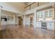Open-concept living area features hardwood floors, custom built-ins, and easy access to the kitchen at , Cumming, GA 30041