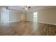 Expansive living room with hardwood floors, neutral walls, and an adjacent walk-in closet at , Cumming, GA 30041