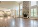 Spacious living room with a stone fireplace, hardwood floors, and an open layout to the kitchen at , Cumming, GA 30041