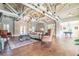 Spacious lounge area with hardwood floors, comfortable seating, and a decorative chandelier at , Cumming, GA 30041