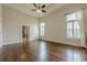 Large main bedroom with tray ceilings, ceiling fan, hardwood floors, and lots of natural light at , Cumming, GA 30041