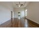 Large main bedroom with tray ceilings, ceiling fan, hardwood floors and neutral paint at , Cumming, GA 30041