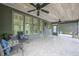 Covered outdoor patio with tile floors, a wood ceiling, and comfortable seating at , Cumming, GA 30041
