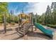 Community playground featuring a slide, climbing structure, and a wood chip surface for safe play at , Cumming, GA 30041