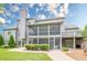Rear exterior with screened porch, deck, and brick patio, ideal for outdoor living and entertaining at , Cumming, GA 30041