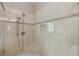 Walk-in shower with a tiled bench and rainfall shower head at , Cumming, GA 30041