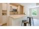 Convenient wet bar features granite countertops, stainless steel microwave, and ample cabinet space at , Cumming, GA 30041