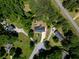 A bird's eye view reveals a secluded property surrounded by lush greenery and mature trees at 35 Brooke Holw, Covington, GA 30016