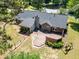 An aerial shot showcases a spacious back deck and landscaped yard perfect for outdoor entertaining at 35 Brooke Holw, Covington, GA 30016
