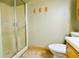 Bathroom showcasing the shower with glass doors and water closet at 35 Brooke Holw, Covington, GA 30016
