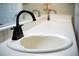 Bathroom with double sink vanity with black fixtures and white countertops at 35 Brooke Holw, Covington, GA 30016
