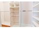 Walk in closet with custom shelving and storage baskets at 35 Brooke Holw, Covington, GA 30016