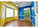 Bright dining area with bay window, colorful walls, and hardwood floors at 35 Brooke Holw, Covington, GA 30016