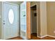 Foyer with hardwood floors, a front door, and a hidden storage area behind a bookcase at 35 Brooke Holw, Covington, GA 30016