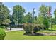 Landscaped front yard with vibrant flowers and a well-maintained lawn at 35 Brooke Holw, Covington, GA 30016
