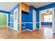 Hallway featuring colorful walls, wood flooring, and access to multiple rooms at 35 Brooke Holw, Covington, GA 30016