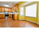 Spacious kitchen with wooden cabinets, stainless steel appliances, and a bright bay window at 35 Brooke Holw, Covington, GA 30016