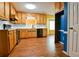 Kitchen with wood cabinets and black appliances, plus breakfast nook at 35 Brooke Holw, Covington, GA 30016