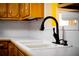 Close-up of the kitchen sink with a modern faucet and white countertops at 35 Brooke Holw, Covington, GA 30016