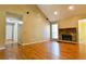 Spacious living room featuring a stone fireplace and hardwood floors at 35 Brooke Holw, Covington, GA 30016