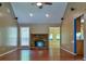 Cozy living room features a stone fireplace, vaulted ceilings and hardwood floors at 35 Brooke Holw, Covington, GA 30016