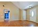 Spacious living room with gleaming hardwood floors and plenty of natural light from the front door at 35 Brooke Holw, Covington, GA 30016
