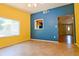 Living room with tile floors, and view of kitchen and front door at 35 Brooke Holw, Covington, GA 30016