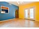 Living room with tile floors, and view of the outdoor patio at 35 Brooke Holw, Covington, GA 30016