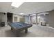 Finished basement with a large open area with pool table and sitting area at 905 Brooksglen Dr, Roswell, GA 30075